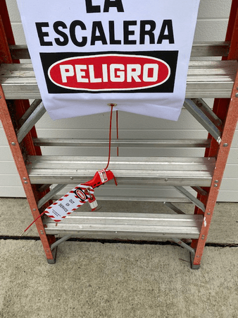 Ladder Lockout Cover Kit - close up view of ladder with sign connectors