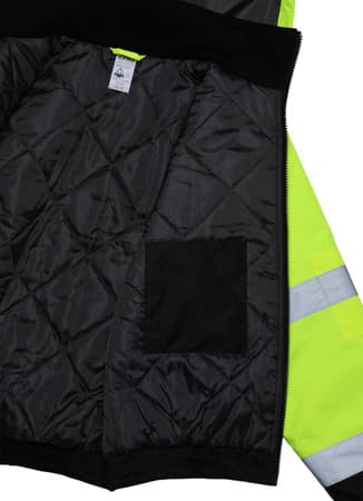 Interior close-up of high-visibility insulated bomber jacket showing black quilted liner and inner chest pocket